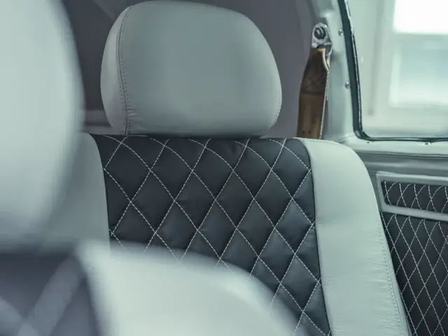 Black quilted leather seat with grey side panels