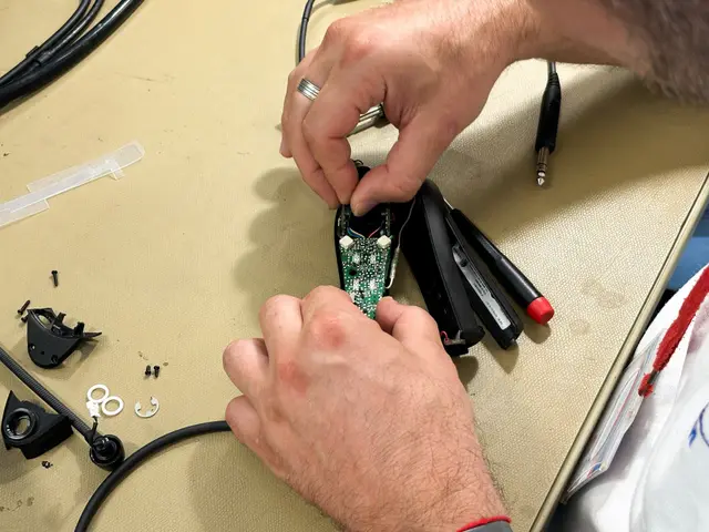 Headset control module opened on the bench for repair