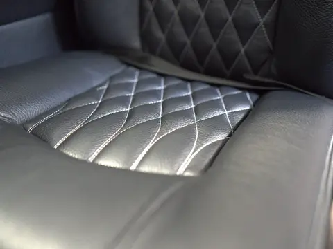 Black leather seat with diamond stitching