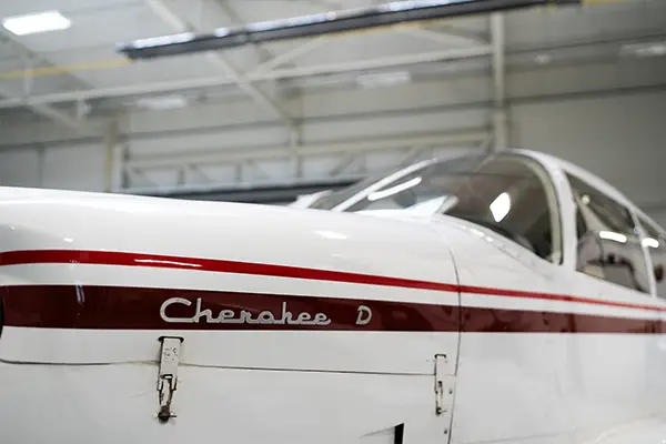 Cherokee nose and cabin roof with fresh white paint and burgundy stripe