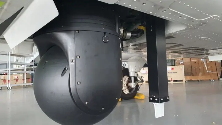 Gyro-stabilised EO/IR turret under a special-mission aircraft