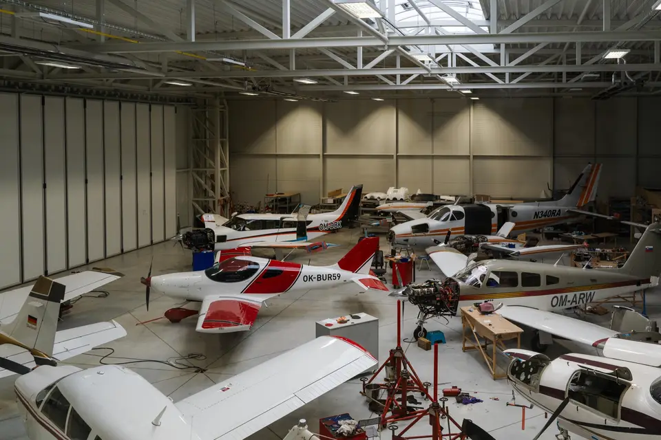 Inside the AIR TEAM hangar in Kunovice with several light aircraft in maintenance