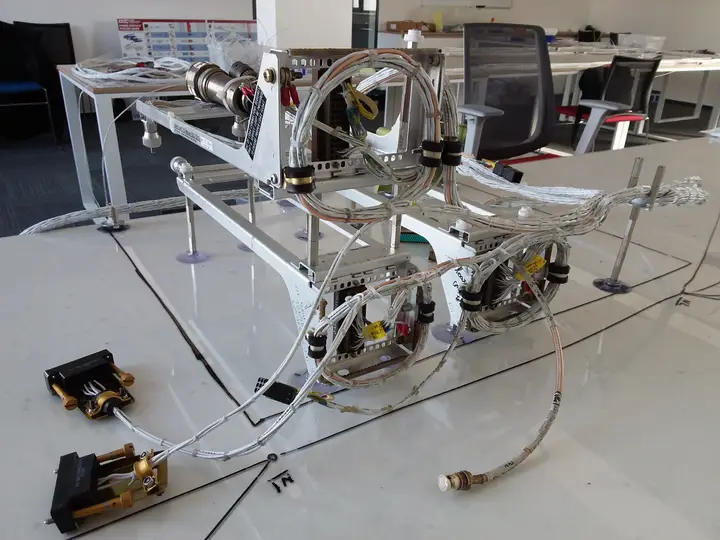 Wiring harness on a continuity test fixture on the lab floor