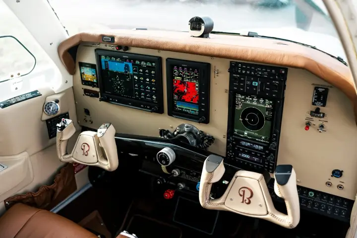 Beechcraft F33A Bonanza cockpit with Garmin G3X displays, GTN 750Xi and a tan and leather interior