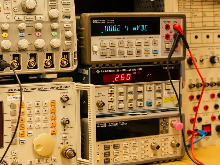 Shelves of calibrated avionics test instruments in the laboratory