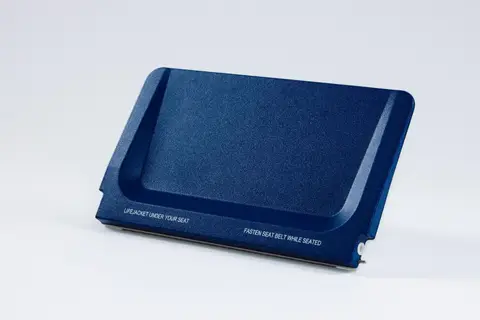 Navy moulded part with a printed instruction placard