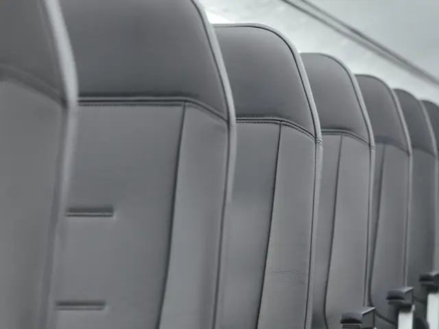 Row of refurbished grey airliner passenger seats