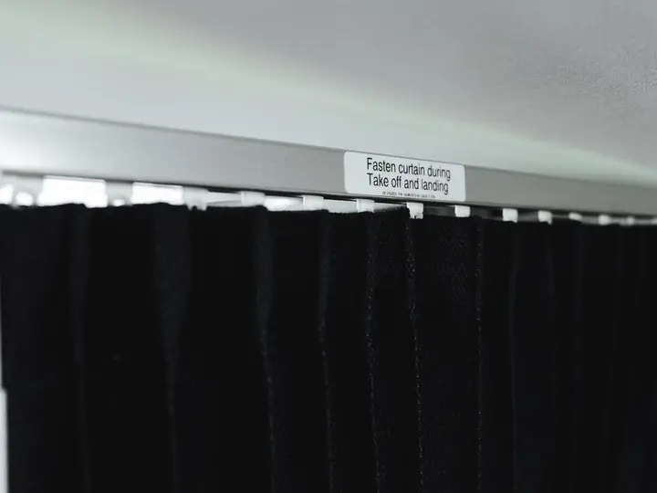 Black curtain with a fastening instruction label