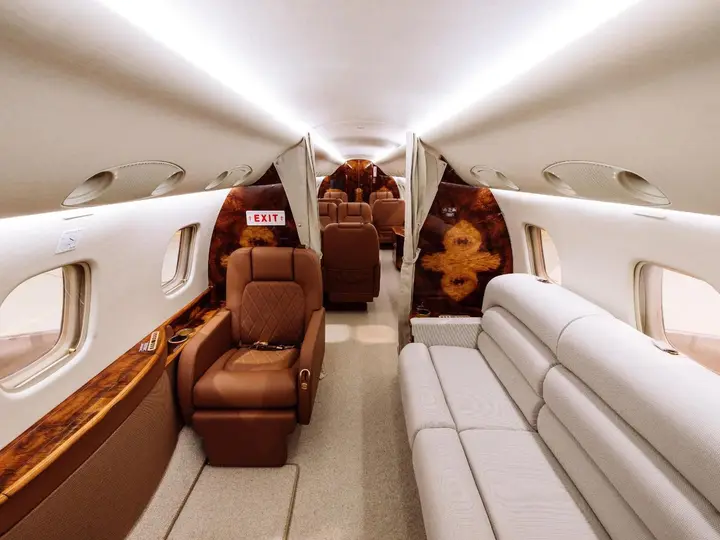 Cabin with divan seating and fabric curtains dividing the zones